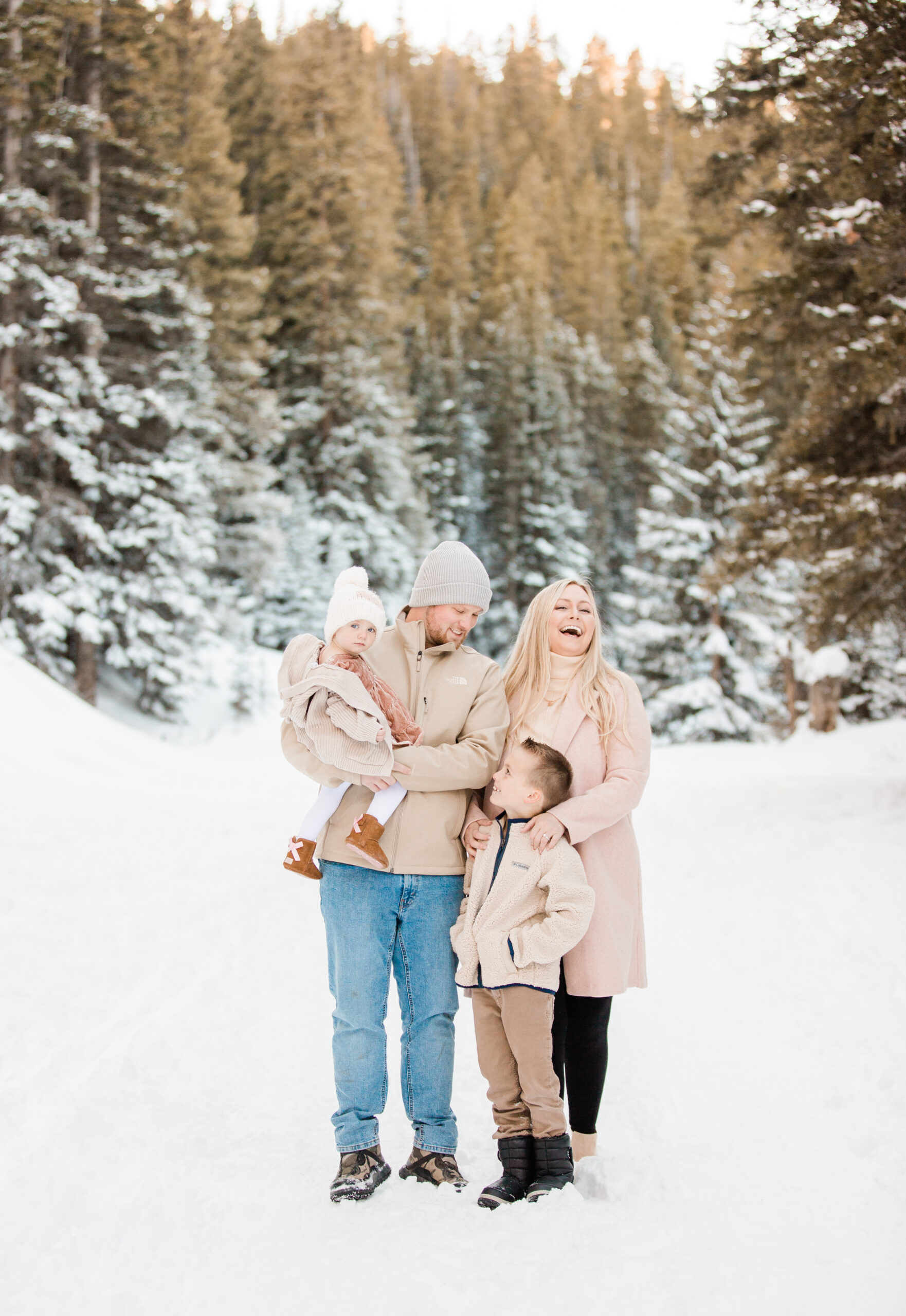 Family of 4 with 2 young kids in the snow