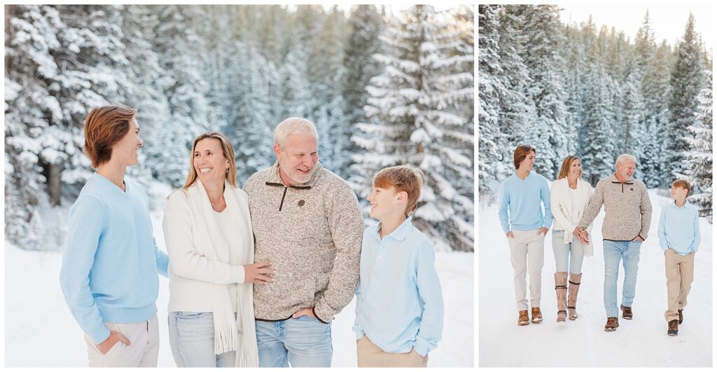 Family of four walks hand in hand through the snowy lanscape